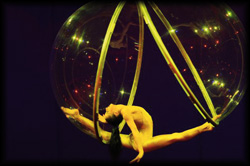 Elegant aerial acrobatics in a floating and opening sphere