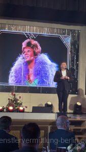 Vocal impersonator at event honors with deceptively real voice of well-known stars