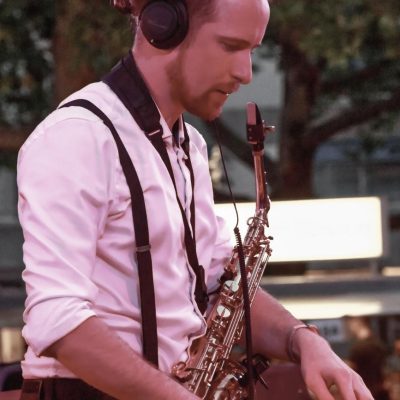 DJ with saxophone combines live saxophone and DJ set for events